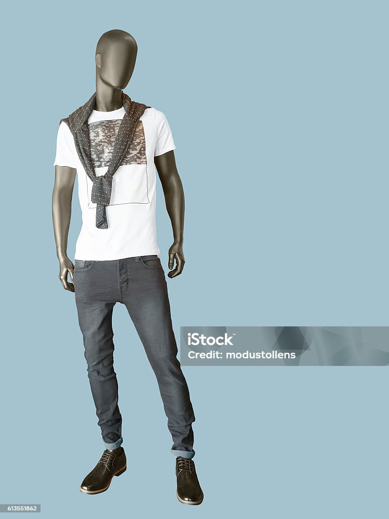 Male mannequin dressed in t-shirt and gray jeans Full length male mannequin dressed in t-shirt and gray jeans, isolated. No brand names or copyright objects. Advertisement Stock Photo