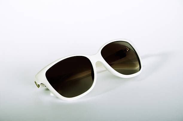 istock one white female sunglasses on a light gray background 613551910