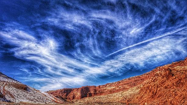 istock Blue Sky White Clouds Over Volcanic Arches National Park Mountain 613552272
