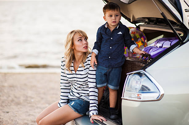 istock Mother and son near the machine. 613552658