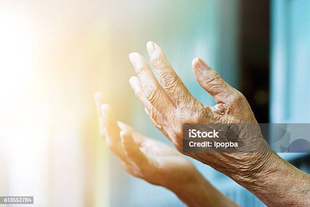 Elderly Woman Hands Praying With Peace Of Mind And Faithfully Stock Photo - Download Image Now
