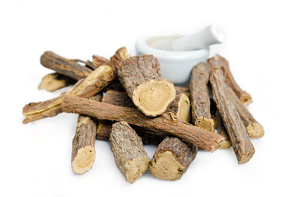 istock Licorice or liquorice root sticks isolated on white background 613552820