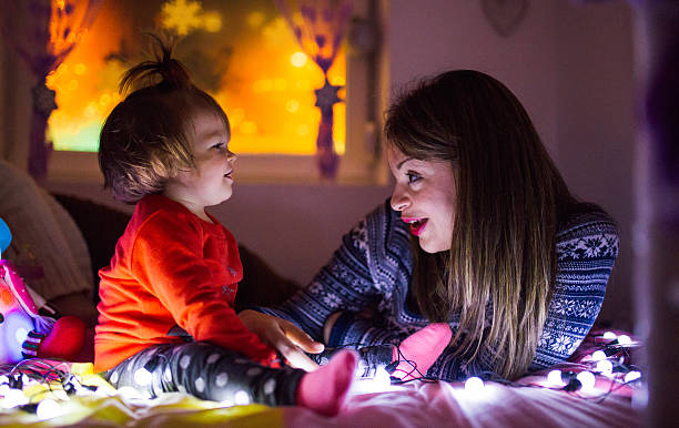 istock Mother and baby celebrating Christmas 613555082