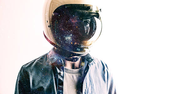 istock Man in helmet with starry sky on shield 613555316