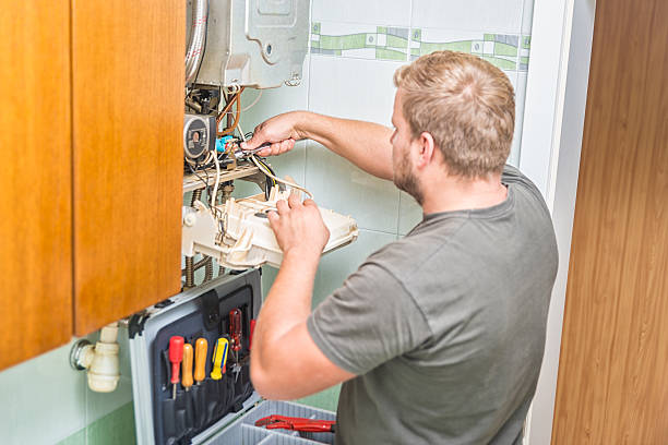 istock Technician repairing Gas Furnace 613556598
