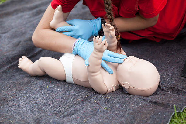 Baby CPR dummy first aid training Infant CPR manikin first aid. Cardiopulmonary resuscitation - CPR. first aid class stock pictures, royalty-free photos & images