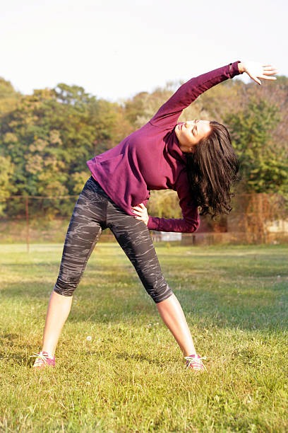 istock Young woman stretching a side 613557522