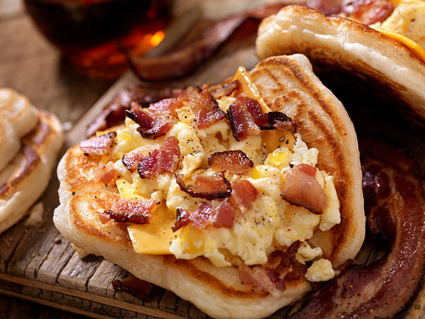 Pancake Breakfast Taco with Scrambled Eggs, Bacon and Cheese Pancake Breakfast Taco - Photographed on Hasselblad H3D2-39mb Camera mexican culture food mexican cuisine fajita stock pictures, royalty-free photos & images