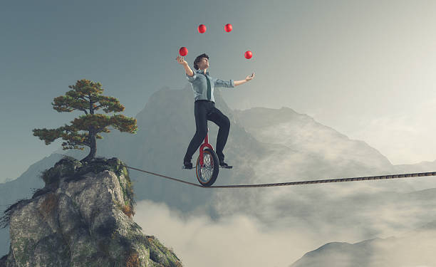 Young man as juggler Juggler is balancing on rope with a bike between two mountains. This is a 3d render illustration agility stock pictures, royalty-free photos & images