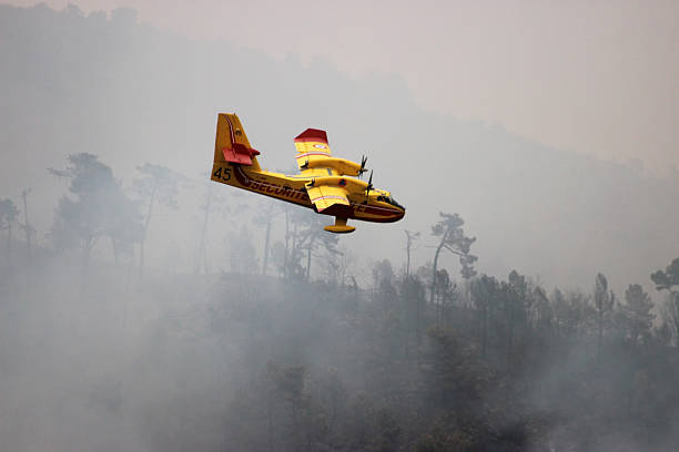 Menton, France - September 9, 2015: Canadair CL-415 (Bombardier 415 Superscooper) Airplane Extinguish Forest in Flame in Menton, French Riviera