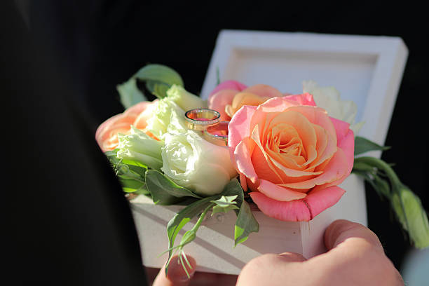 istock White wooden box for rings with fresh flowers, 613561468