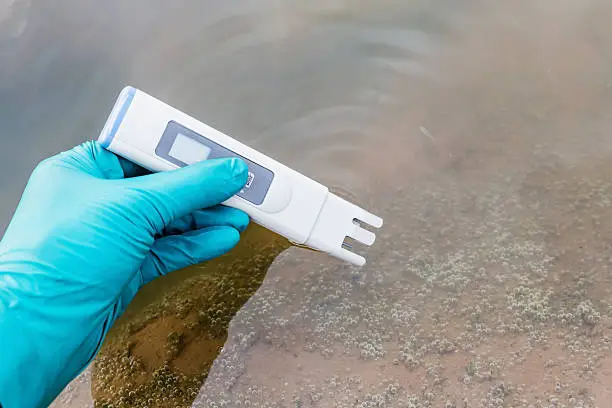 hand hold water quality tester and take sampling water for analysis