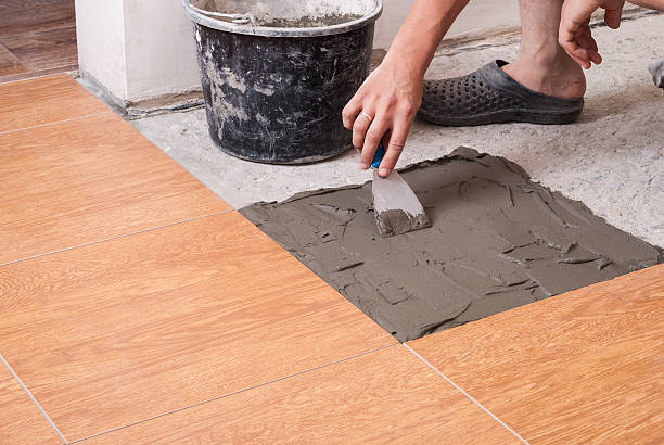 istock laying tiles on the floor 613561622