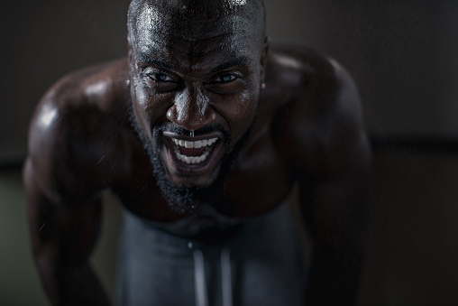 Sweaty man during intense workout.