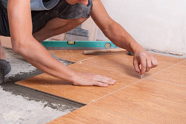 istock laying tiles on the floor 613562224