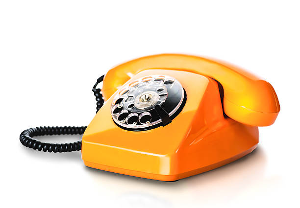istock Vintage orange telephone on white 613562460