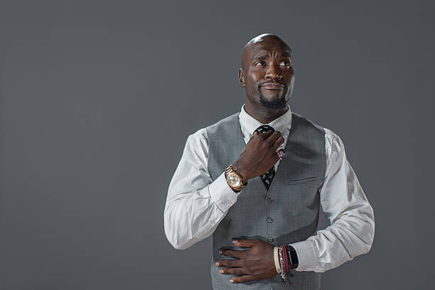 istock Confident Aftrican American man fixing his tie 613563022