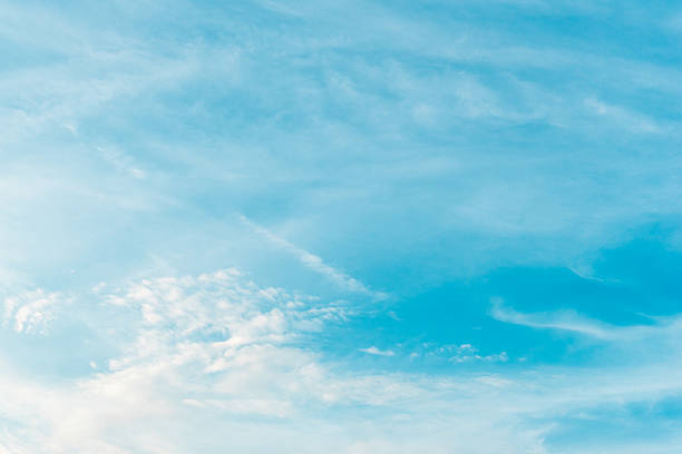 istock blue sky background and clouds in daylight time 613563938