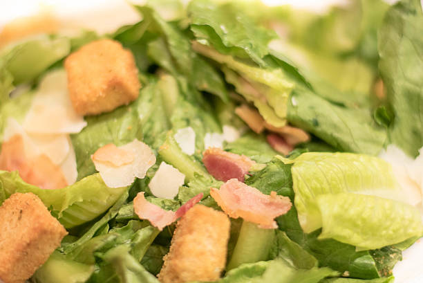 istock Bacon Caesar Salad with Shredded Parmeasan Cheese and Bread Cubes 613564088