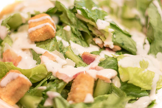 istock Bacon Caesar Salad with Shredded Parmeasan Cheese and Bread Cubes 613564102