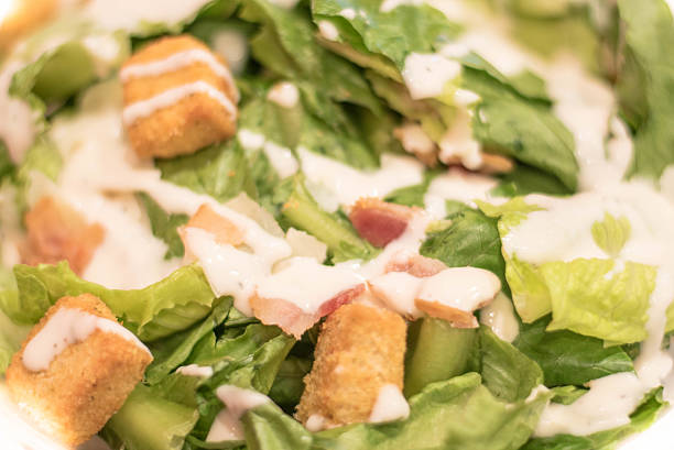 istock Bacon Caesar Salad with Shredded Parmeasan Cheese and Bread Cubes 613564106