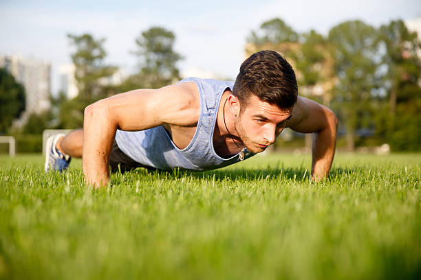 istock Handsome young caucasian man training in park 613652080