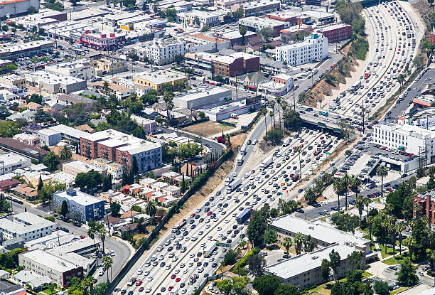 Interstate 110 in Los Angeles Los Angeles, United States - May 27, 2015: Aerial view of heavy traffic on Interstate 110, Santa Monica Boulevard is crossing. los angeles traffic jam stock pictures, royalty-free photos & images