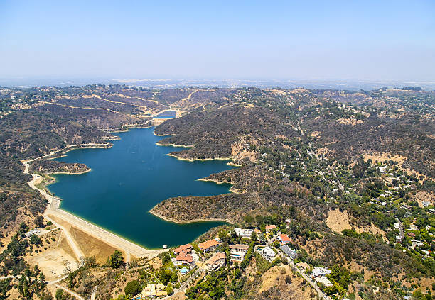 Stone Canyon Reservoir Los Angeles, United States - May 27, 2015: Aerial view of the Stone Canyon Reservoir in Bel Air. There are some estates built next to the lake. bel air photos stock pictures, royalty-free photos & images