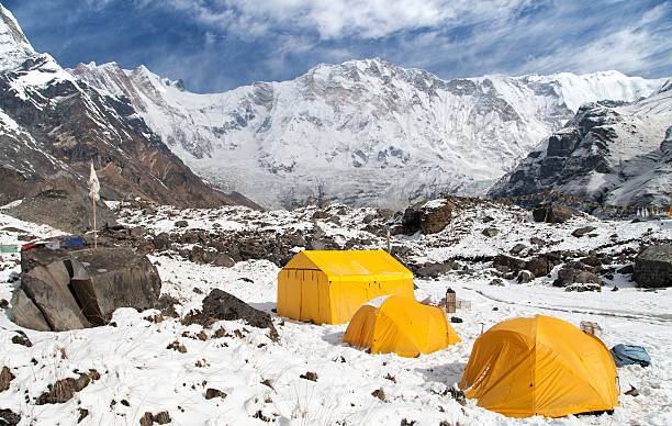 View of Mount Annapurna with tents from base camp, Nepal View of Mount Annapurna with tents from base camp, Nepal base camp stock pictures, royalty-free photos & images