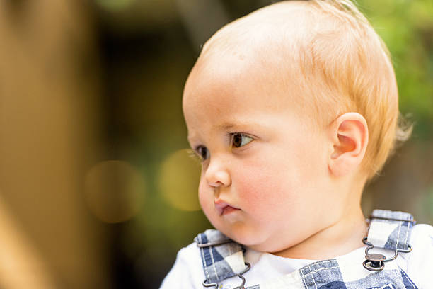 istock Baby boy looking away 613655078