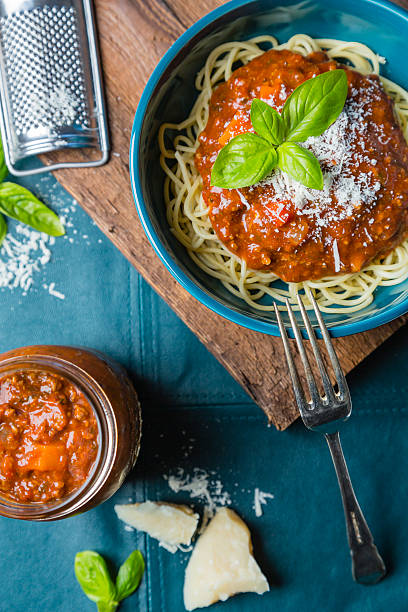 istock Bolognese spaghetti with cheese and basil 613655738