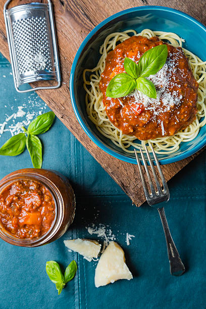 istock Bolognese spaghetti with cheese and basil 613655806