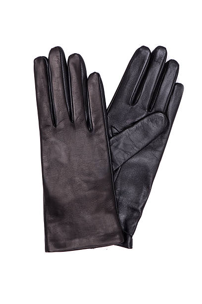 istock Black female leather gloves isolated on white background 613656664