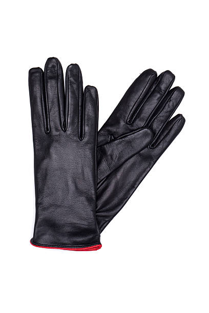 istock Black female leather gloves isolated on white background 613656738
