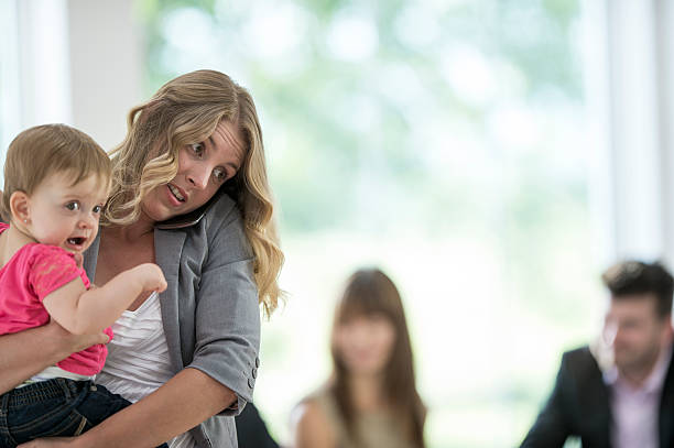 istock Mother Watching Her Child at the Office 613657052