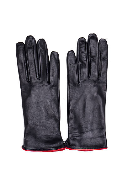 istock Black female leather gloves isolated on white background 613657294