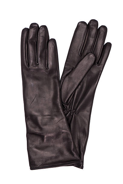 istock Black female leather gloves isolated on white background 613657728