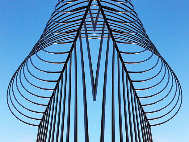 istock Digitally composed photo of steel framework against blue sky 613657874