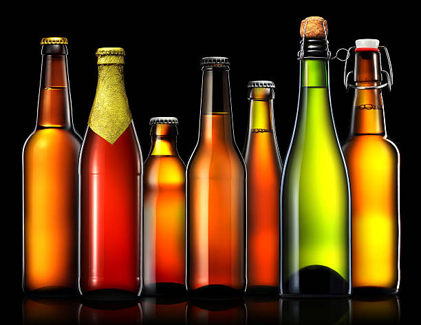 istock Set of beer bottles isolated on black background 613658030