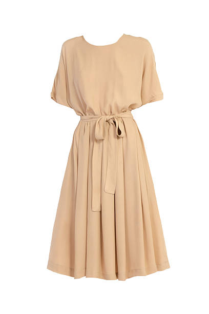 istock beige dress isolated on white 613659096