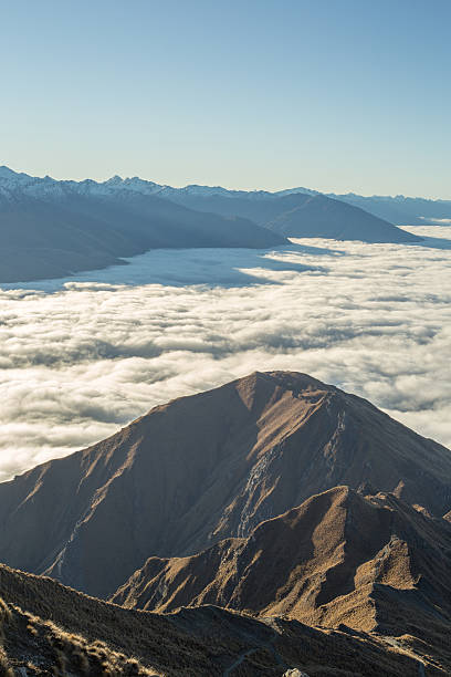 istock View from a mountain peak, above the clouds 613660706