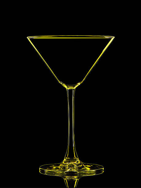 istock Silhouette of yellow martini on black background 613660812