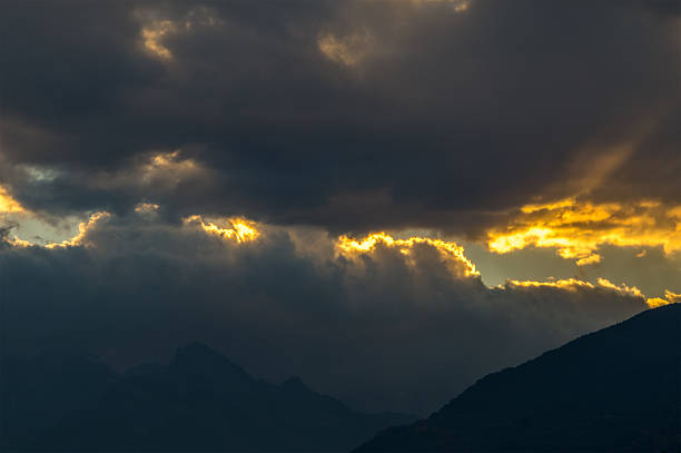 istock yellow sky, colorful sunset in the mountains 613661540