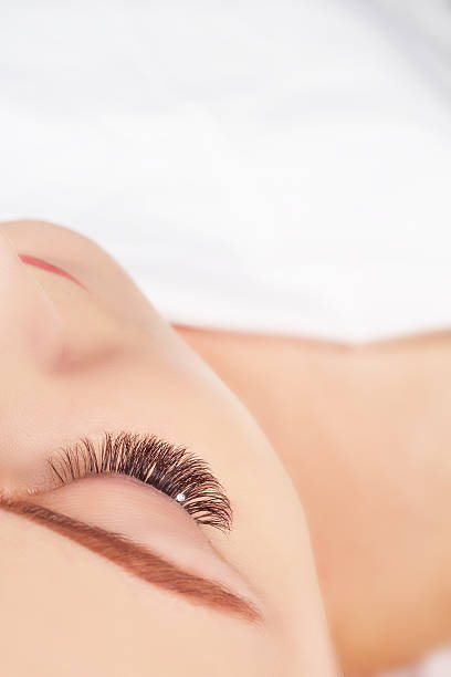 istock Eyelash Extension Procedure. Woman Eye with Long Eyelashes. Eyelashes with 613662666