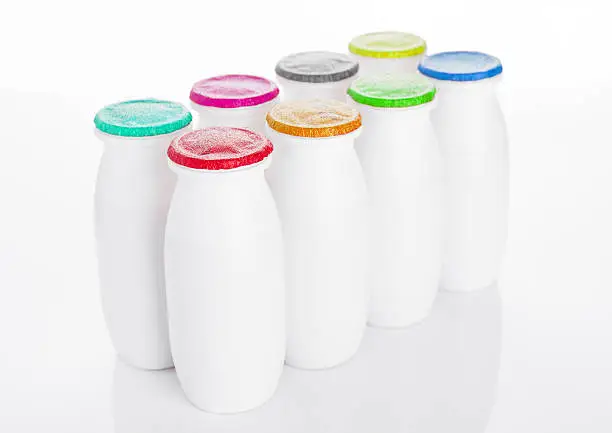 Yogurt containers healthy vitamin drink on white background