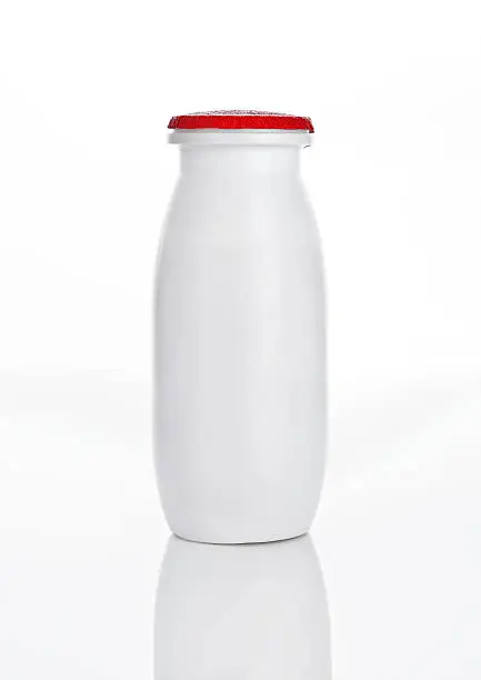 Yogurt container healthy vitamin drink on white background