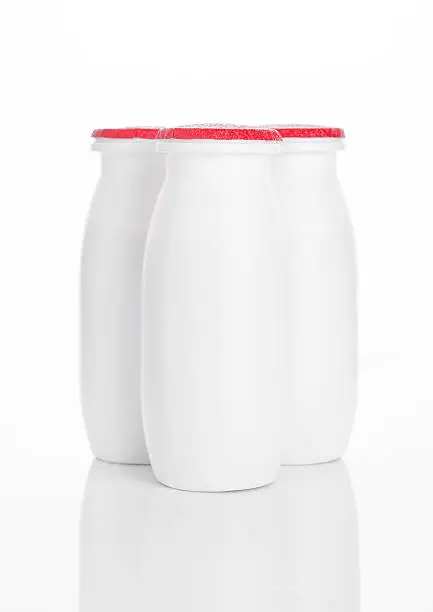 Yogurt containers healthy vitamin drink on white background