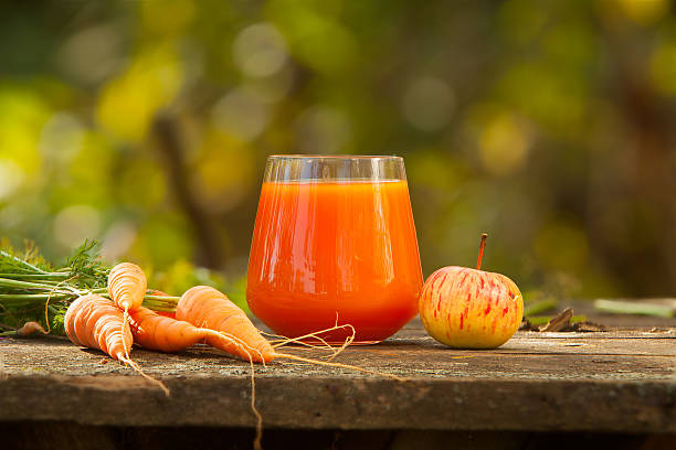 appetizing juice from carrots and apples stock photo