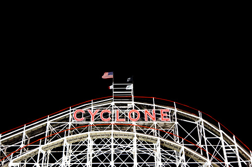 New York, NY USA - August 30, 2016: Cyclone: Historical landmark Cyclone roller coaster  in the Coney Island section of Brooklyn. Cyclone is a historic wooden roller coaster opened on June 26, 1927.