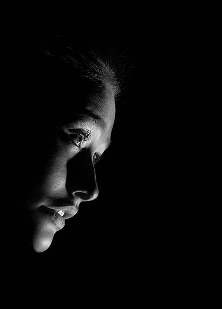 istock girl in the dark monochrome 613668058